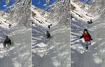 Siirt'te çocuklar karın keyfini böyle çıkardı: Kendi yaptıkları kayaklarla doyasıya eğlendiler